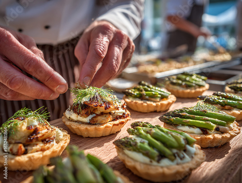 A chef demonstrating the preparation of traditional Danish tartlets at the festival. Ingredients like puff pastry, chicken, and asparagus neatly arranged on the table.