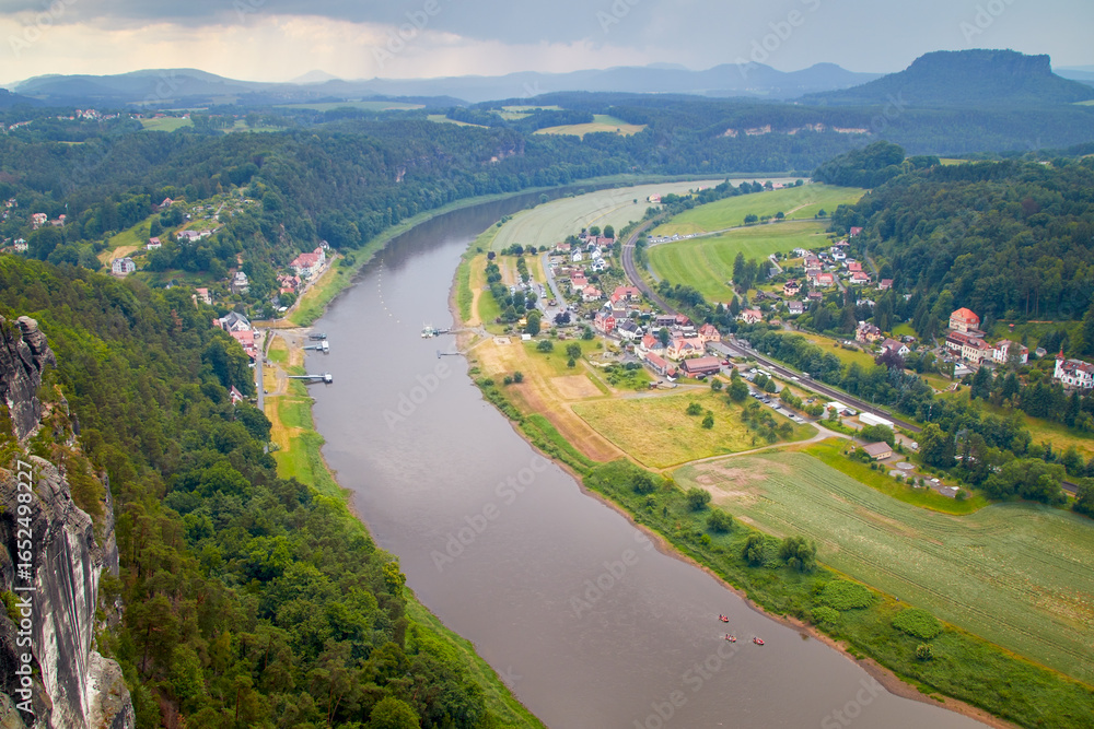 Fototapeta premium View of the hiking village of Rathen in Saxon Switzerland from the viewpoint called Bastei