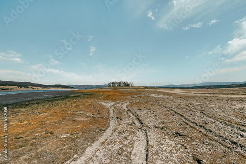 road to a half island surrounded by lake
