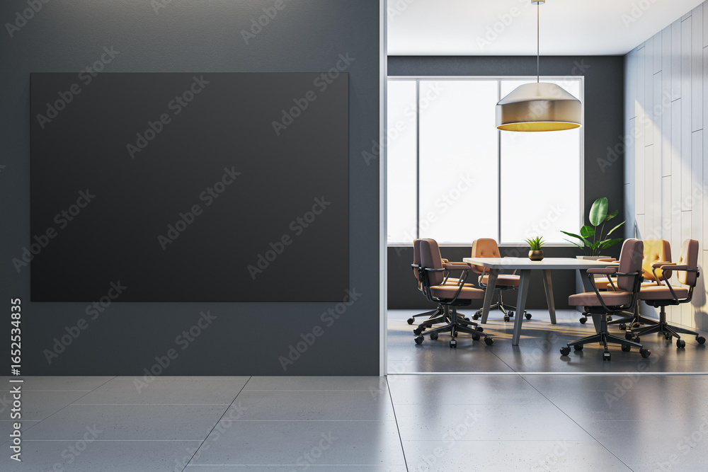 Fototapeta premium Empty black poster mockup on dark wall near modern office meeting room with large window and chairs in corporate interior design setting. 3D Rendering