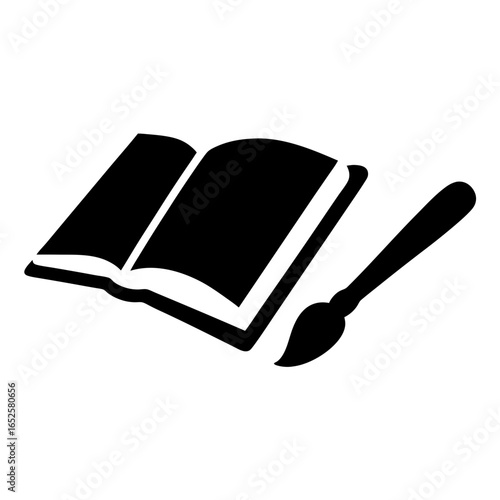 Open book with paintbrush suggesting creative writing or illustrating stories concepts