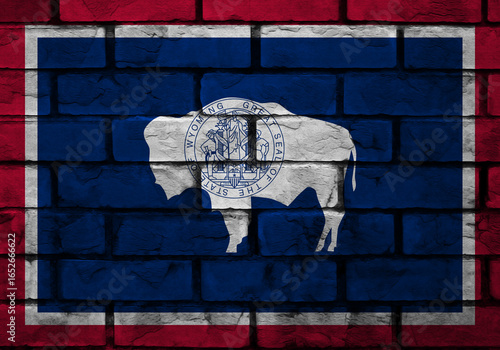 Vibrant Wyoming bison mural on a brick wall, showcasing state pride