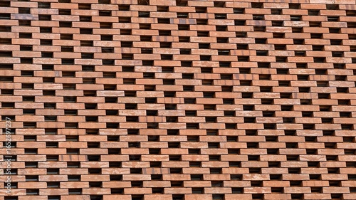 Open brick pattern for a modern and industrial aesthetic, Textured brick wall in a staggered pattern for architectural design and backdrop
