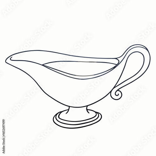 Stainless steel sauce boat with spout and small side handle for gravy or sauce serving with copy space for holiday meals