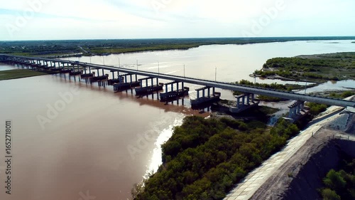 Wallpaper Mural A stunning aerial view of a picturesque river bridge, beautifully surrounded by a lush landscape Torontodigital.ca