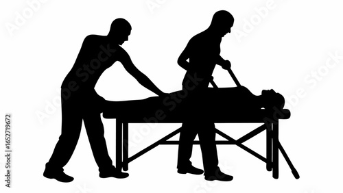Silhouette of two people assisting a person lying on a table with a stick in a black and white image