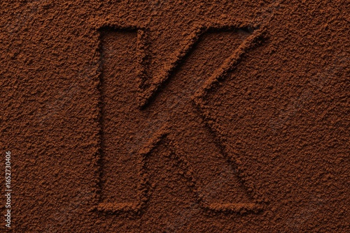 Letter K crafted from coffe...