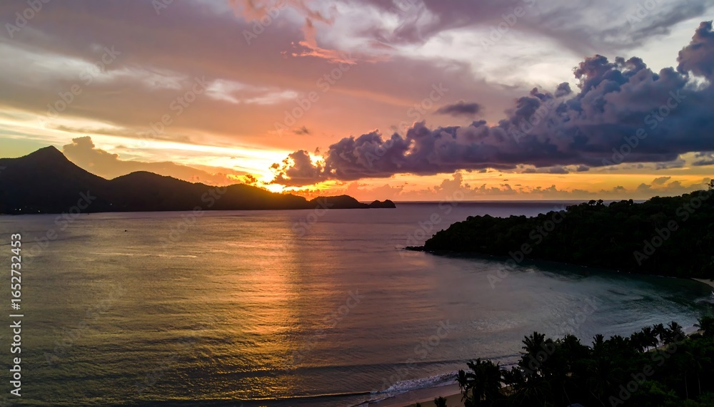 Fototapeta premium Tropical sunset over calm bay
