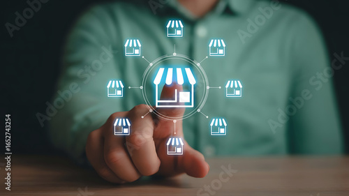 Person touching a glowing digital network of franchise store icons representing business expansion and growth opportunities