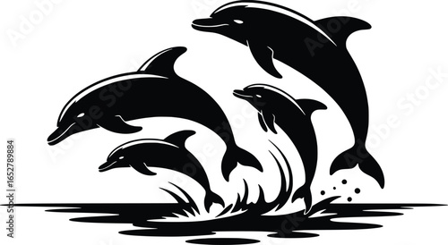 Silhouette of a pod of dolphins leaping from the water