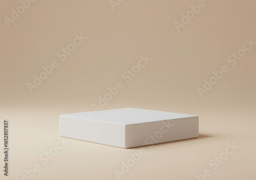 Minimalist Product Photography of White Square Pedestal on Beige Background