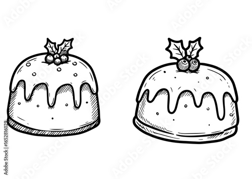 Christmas puddings with icing and holly decorations  