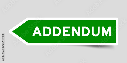 Green color arrow shape sticker label with word addendum on gray background