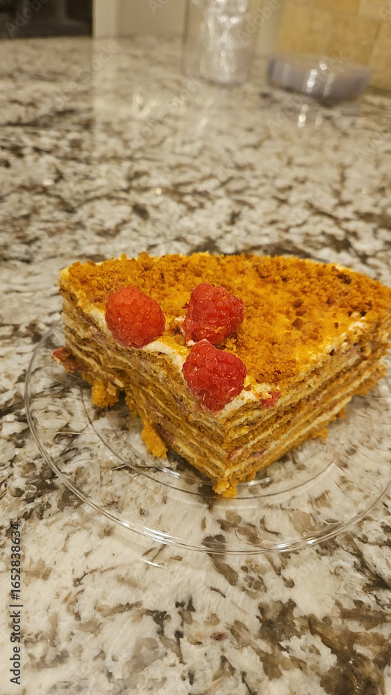 Naklejka premium Honey cake with raspberries 