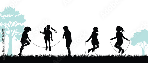 Children Skipping Rope Silhouette in Park