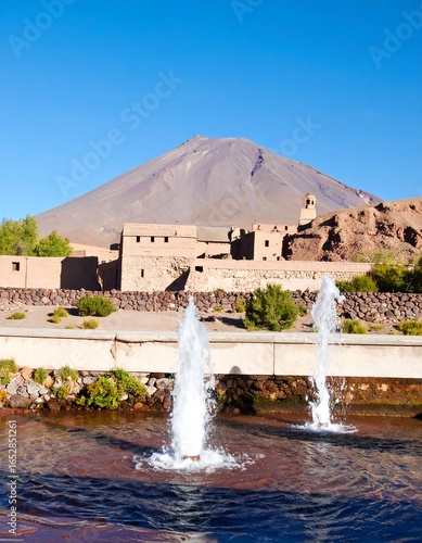 Desert oasis with volcano
