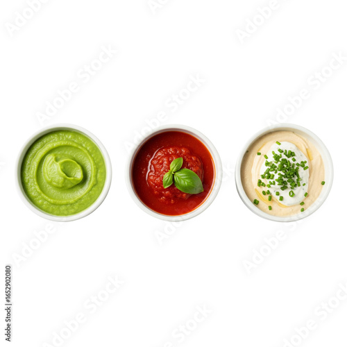 Three delicious dips in white bowls on a white background
