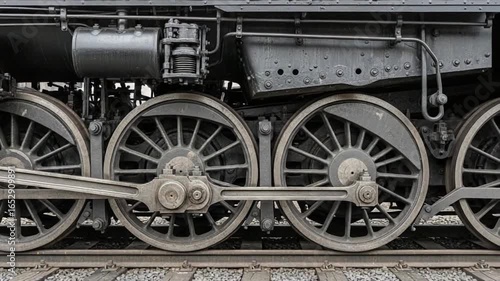 Steam train moving along railway tracks