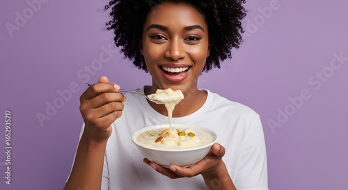 Happy African American Woman Enjoying Rice Pudding