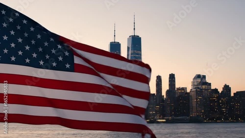 American flag waving with new york city skyline in the background view