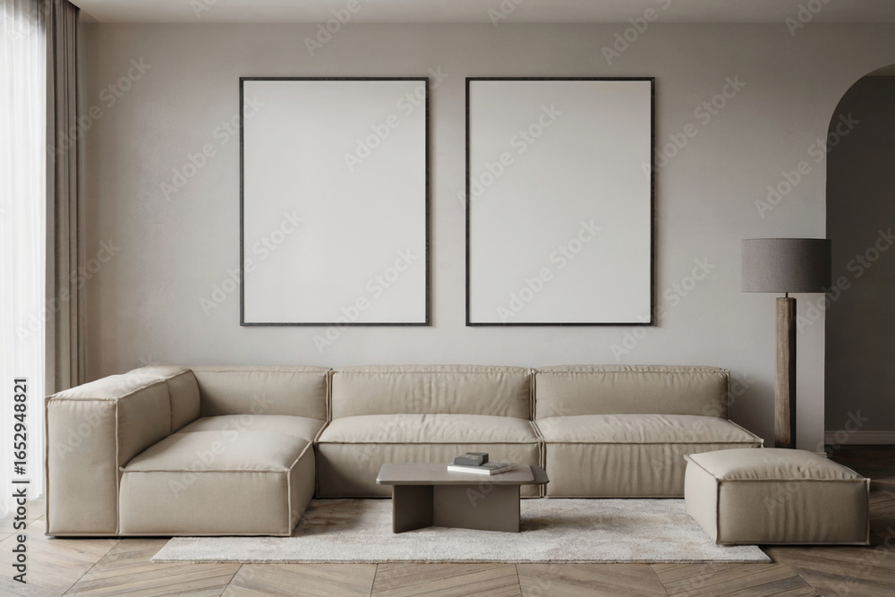 Fototapeta premium Modern minimalist living room interior with beige sofa, two blank canvases, and floor lamp.