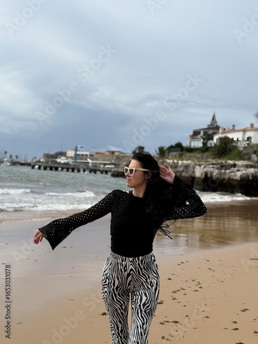 young woman walking on the beach