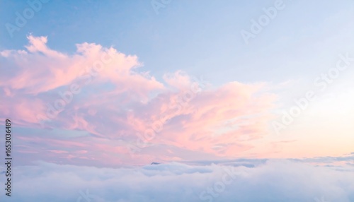 Pastel-hued clouds gently drift across a tranquil sky, painting a serene and ethereal scene above a layer of soft, white clouds.