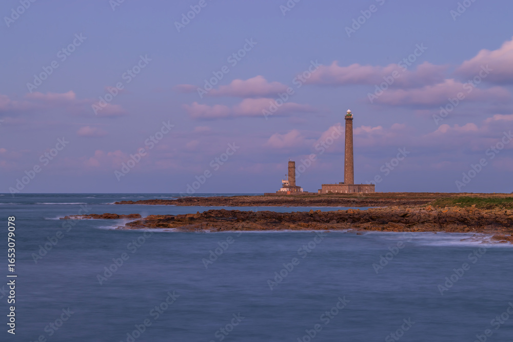 Fototapeta premium Gatteville Lighthouse standing tall at sunset in Normandy, France