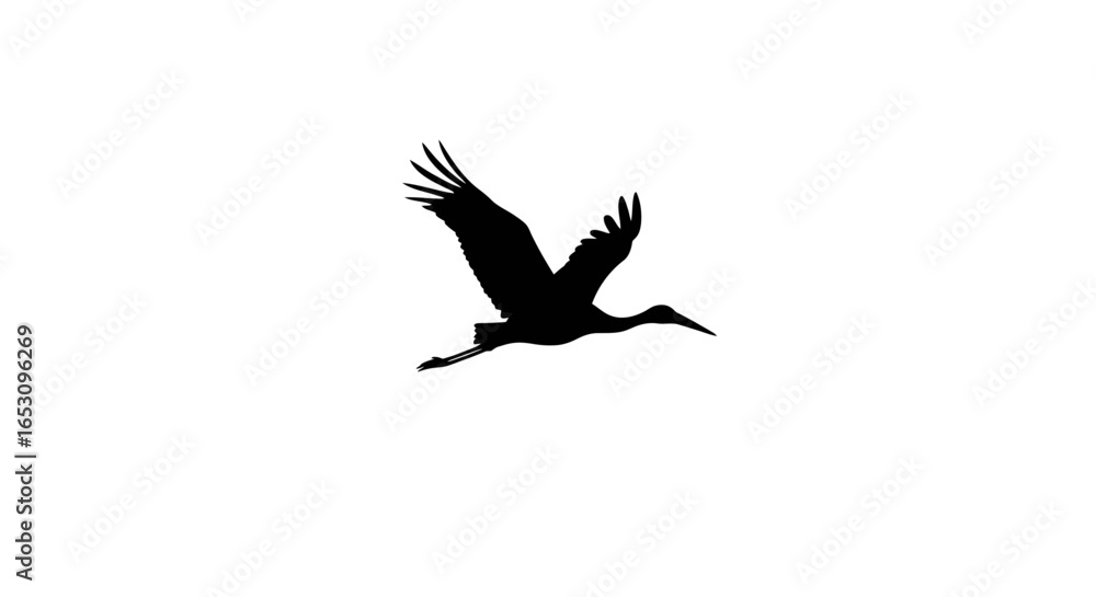 Obraz premium Elegant Black Silhouette of a Crane in Flight