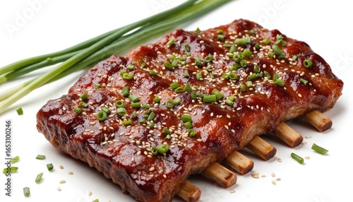 Juicy Korean galbi short ribs, sesame seeds, green onions on white. Dish, delicious meat for lunch or dinner. Barbecue grill, tasty food. Asian cuisine, traditional meal.