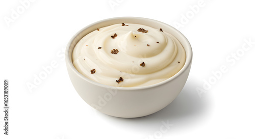 Indulgent creamy mayonnaise swirled with rich truffle flakes in a pristine white bowl, perfect for gourmet culinary presentations.