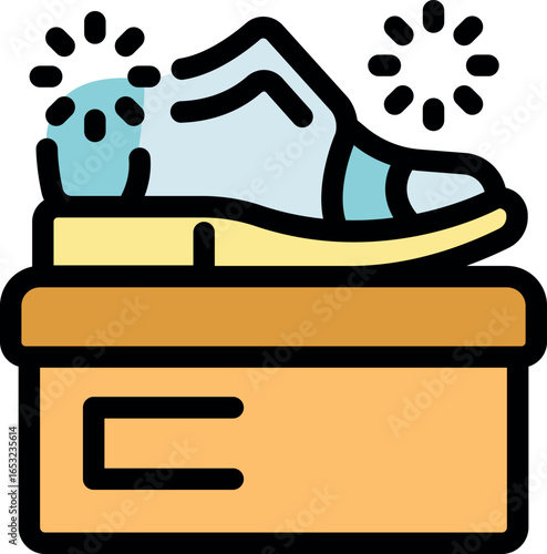 Electric shoe buffer polishing footwear on box, creating sparkling clean surface, perfect for shoe care and maintenance