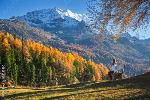 Woman sitting on a bench in...