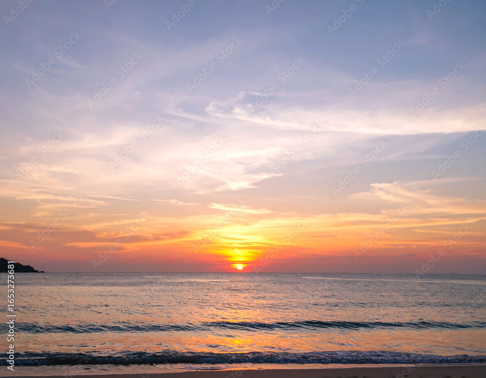 Fototapeta premium Serene Tropical Sunset: Ocean Beachscape with Warm Colors and Gentle Waves at Dusk