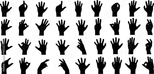 A diverse collection of black hand silhouettes in various poses and gestures. A conceptual graphic set for nonverbal communication and signs.