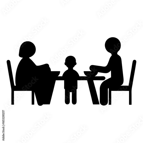 Family mealtime silhouette with adults and child at a dining table