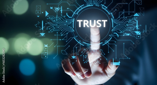 Finger touching digital screen with the word trust illuminated