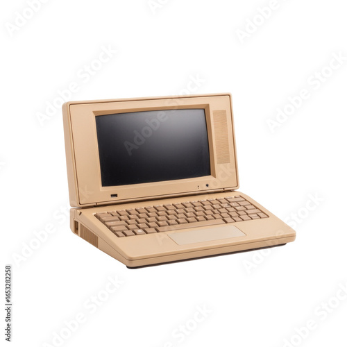 Vintage beige laptop with black screen and keyboard from 1980s