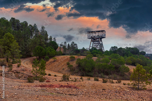 Abandoned Mine Tower at Dawn with Dramatic Clouds