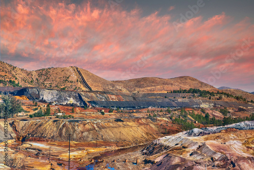 Open-Pit Mine Landscape with Colorful Earth and a Red Sky