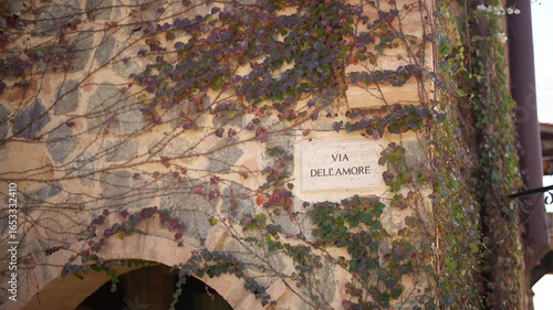 sign on a stone wall