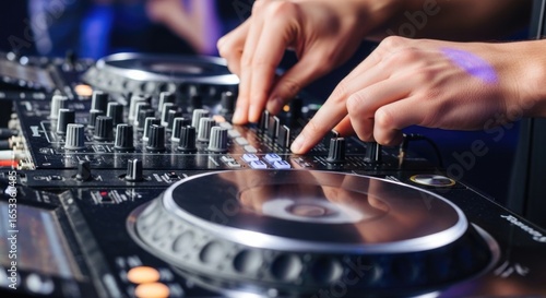 Close-up of dj mixing music on professional equipment at nightclub event