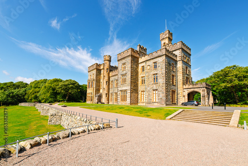 Photos View of Lews Castle, a gothic revival styled Scottish castle built in the 1800s overlooking the harbor and town of Stornoway, Scotland, Lewis and Harris island, Outer Hebrides