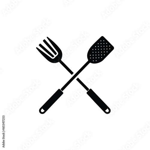 Crossed barbecue fork and spatula on white background