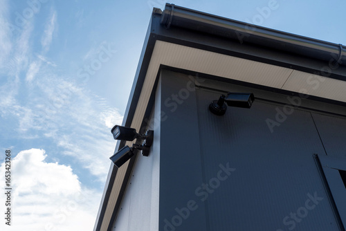 Security camera on modern metal building