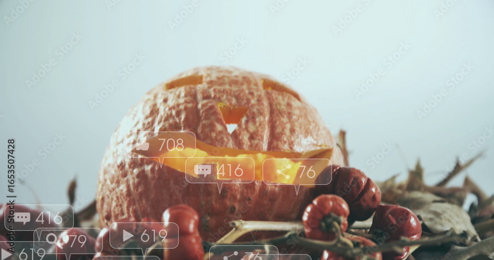 Fototapeta premium Carved pumpkin with social media notifications image over autumn decorations