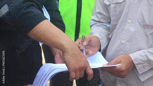 Technical staff, site supervisors, and road officials discuss highway repair plans, evaluating rigid pavement and asphalt solutions for durable infrastructure improvements.
