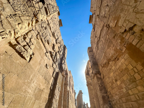 Photography Ancient statues and obelisk at the entrance of Luxor Temple