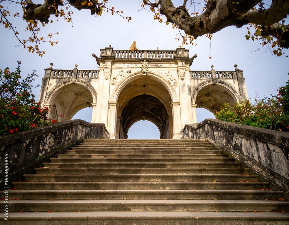 Fototapeta premium Ancient stone steps leading to a grand archway (1)