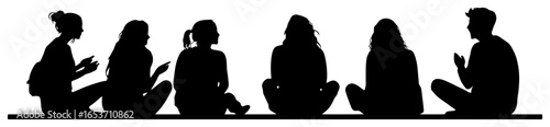 Silhouette of Group of Friends Sitting on a Low Wall Chatting